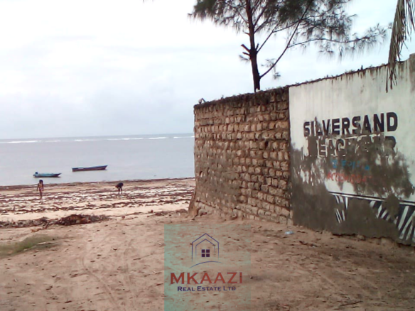 Fully furnished 2-bedroom luxury apartment for sale in Silver Rock Malindi along Casuarina Road featuring beach access, swimming pool, private garden, spacious rooms, porch, bathtub, and 24/7 security.