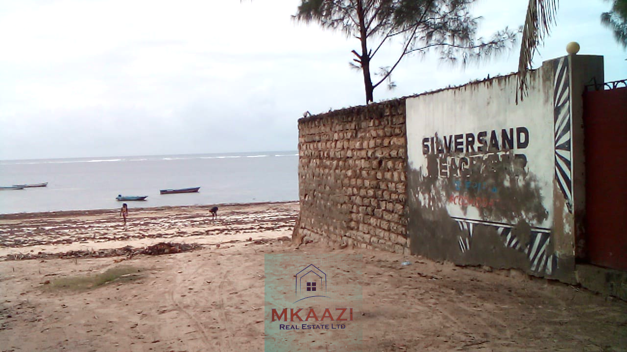 Fully furnished 2-bedroom luxury apartment for sale in Silver Rock Malindi along Casuarina Road featuring beach access, swimming pool, private garden, spacious rooms, porch, bathtub, and 24/7 security.