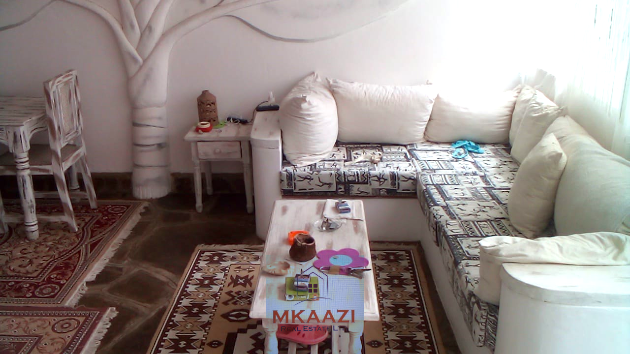 Fully furnished 2-bedroom luxury apartment for sale in Silver Rock Malindi along Casuarina Road featuring beach access, swimming pool, private garden, spacious rooms, porch, bathtub, and 24/7 security.