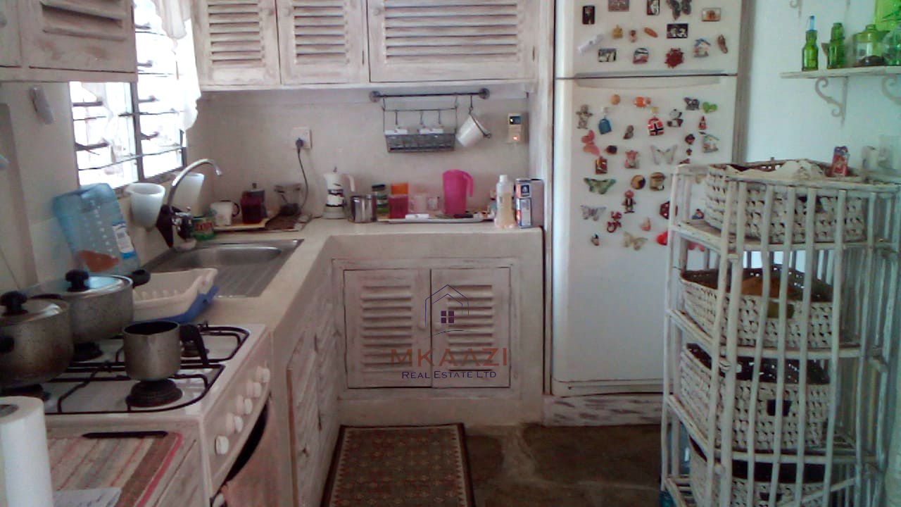 Fully furnished 2-bedroom luxury apartment for sale in Silver Rock Malindi along Casuarina Road featuring beach access, swimming pool, private garden, spacious rooms, porch, bathtub, and 24/7 security.
