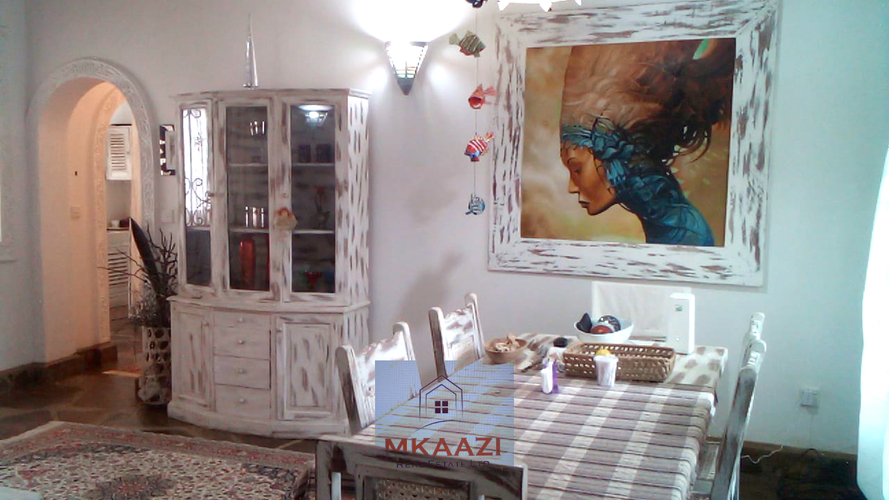 Fully furnished 2-bedroom luxury apartment for sale in Silver Rock Malindi along Casuarina Road featuring beach access, swimming pool, private garden, spacious rooms, porch, bathtub, and 24/7 security.