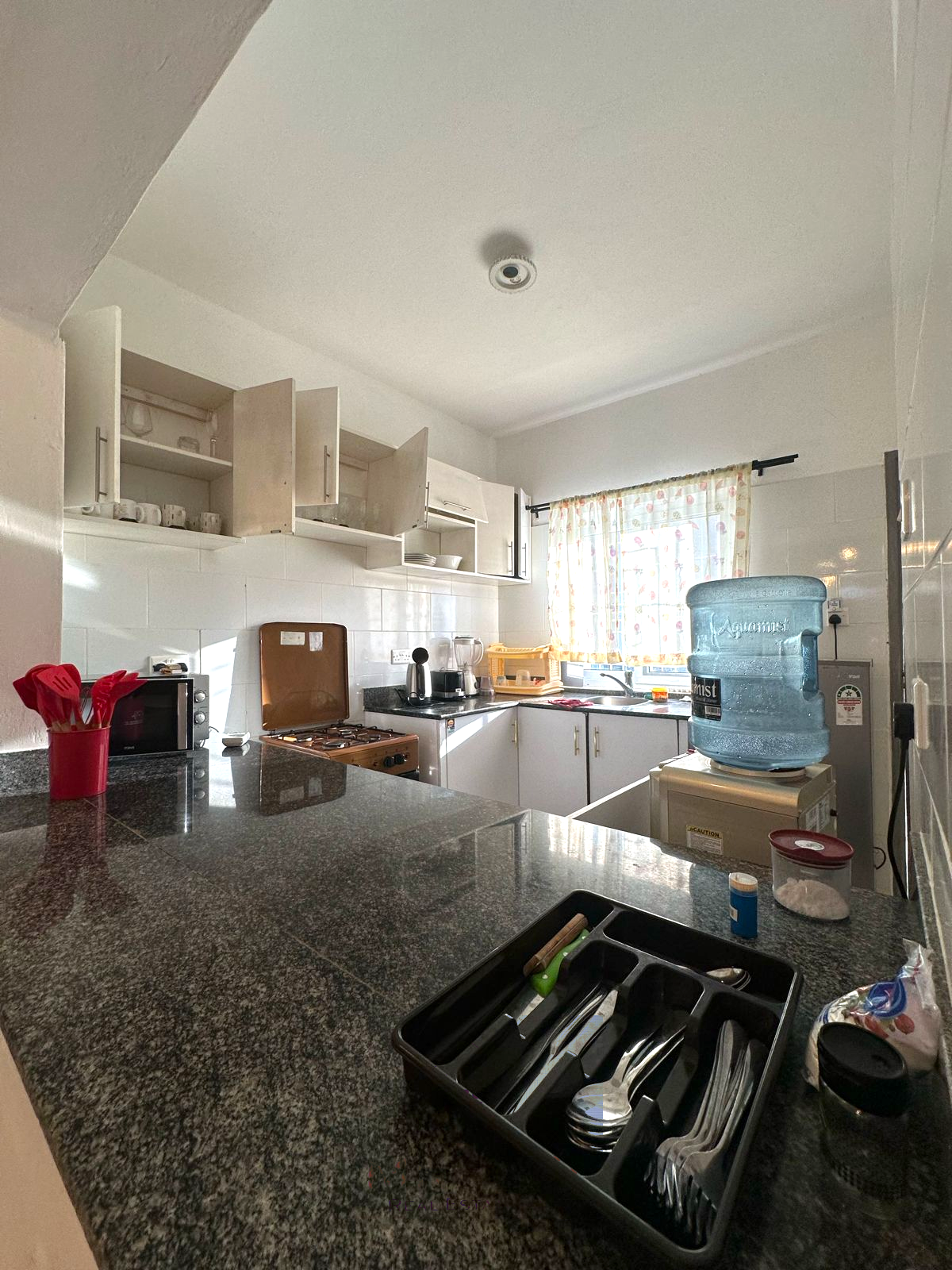 Fully furnished 2-bedroom apartment for sale in Kijani Malindi featuring spacious bedrooms, balcony views, swimming pool access, and walking distance to the beach.