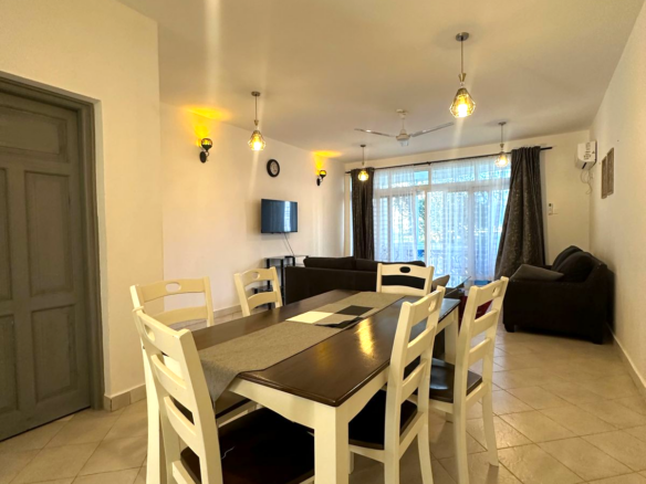 Fully furnished 2-bedroom apartment for sale in Kijani Malindi featuring spacious bedrooms, balcony views, swimming pool access, and walking distance to the beach.
