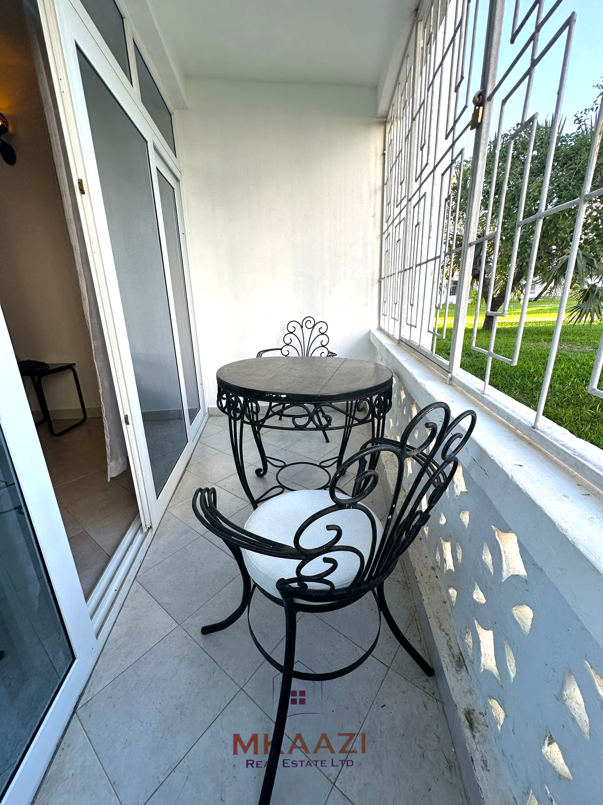 Fully furnished 2-bedroom apartment for sale in Kijani Malindi featuring spacious bedrooms, balcony views, swimming pool access, and walking distance to the beach.