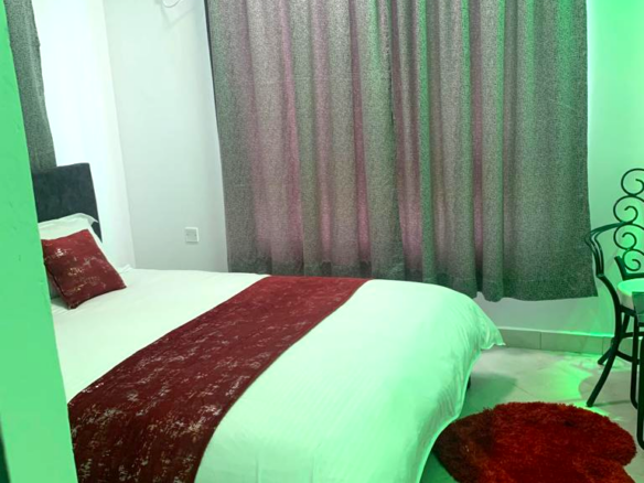 Fully furnished 2-bedroom apartment for sale in Kijani Malindi featuring spacious bedrooms, balcony views, swimming pool access, and walking distance to the beach.