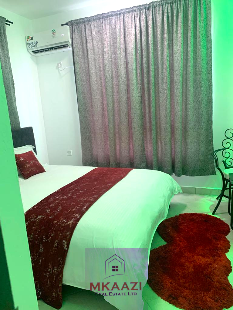 Fully furnished 2-bedroom apartment for sale in Kijani Malindi featuring spacious bedrooms, balcony views, swimming pool access, and walking distance to the beach.