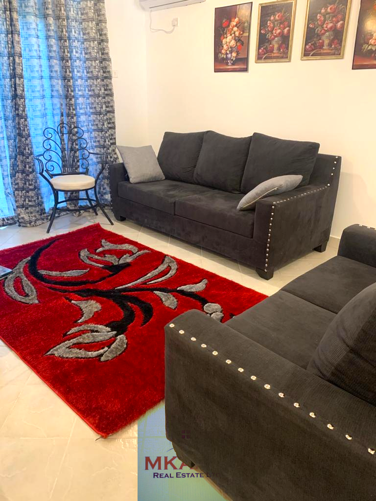 Fully furnished 2-bedroom apartment for sale in Kijani Malindi featuring spacious bedrooms, balcony views, swimming pool access, and walking distance to the beach.