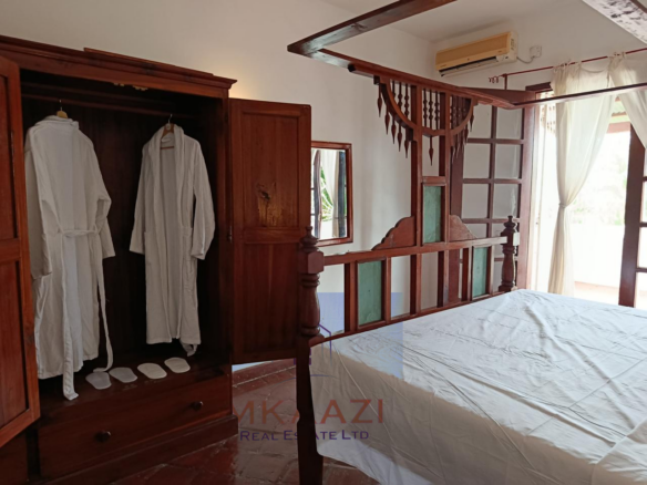 3-bedroom all en-suite semi-furnished villa for sale in Kilimandogo, Malindi featuring a private garden, servant's quarter, two swimming pools, 24-hour security, and secure gated community living. Ideal for family residence, holiday home, retirement living, or rental investment.