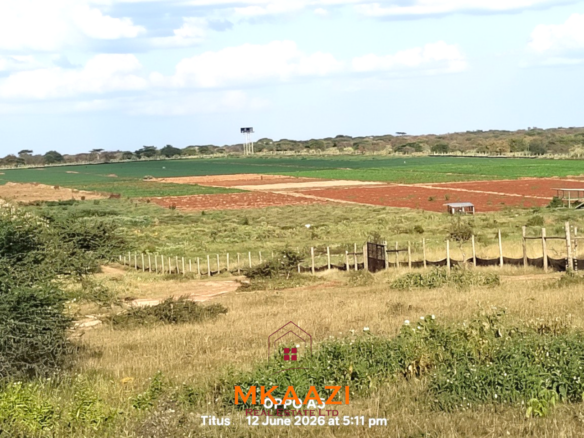 7-acre freehold agricultural land for sale in Megumi featuring fertile red soil, good road access, groundwater potential, clean title deed, and suitability for farming, livestock keeping, agro-processing, and land banking.