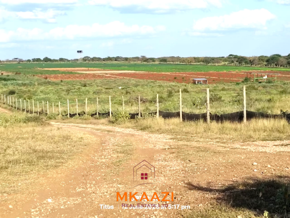 7-acre freehold agricultural land for sale in Megumi featuring fertile red soil, good road access, groundwater potential, clean title deed, and suitability for farming, livestock keeping, agro-processing, and land banking.