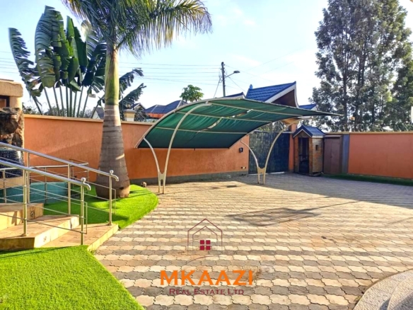 Luxury 6-bedroom all-ensuite mansion for sale in Githingiri Estate, Thika, featuring a gym, safe room, CCTV surveillance, automated gate, electrified perimeter wall, and 35,000-litre underground water tank.