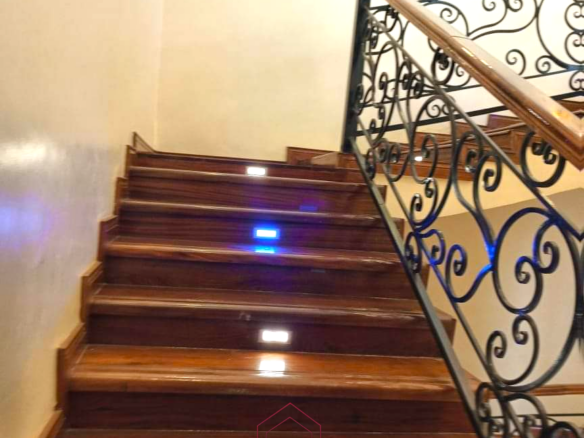 Luxury 6-bedroom all-ensuite mansion for sale in Githingiri Estate, Thika, featuring a gym, safe room, CCTV surveillance, automated gate, electrified perimeter wall, and 35,000-litre underground water tank.
