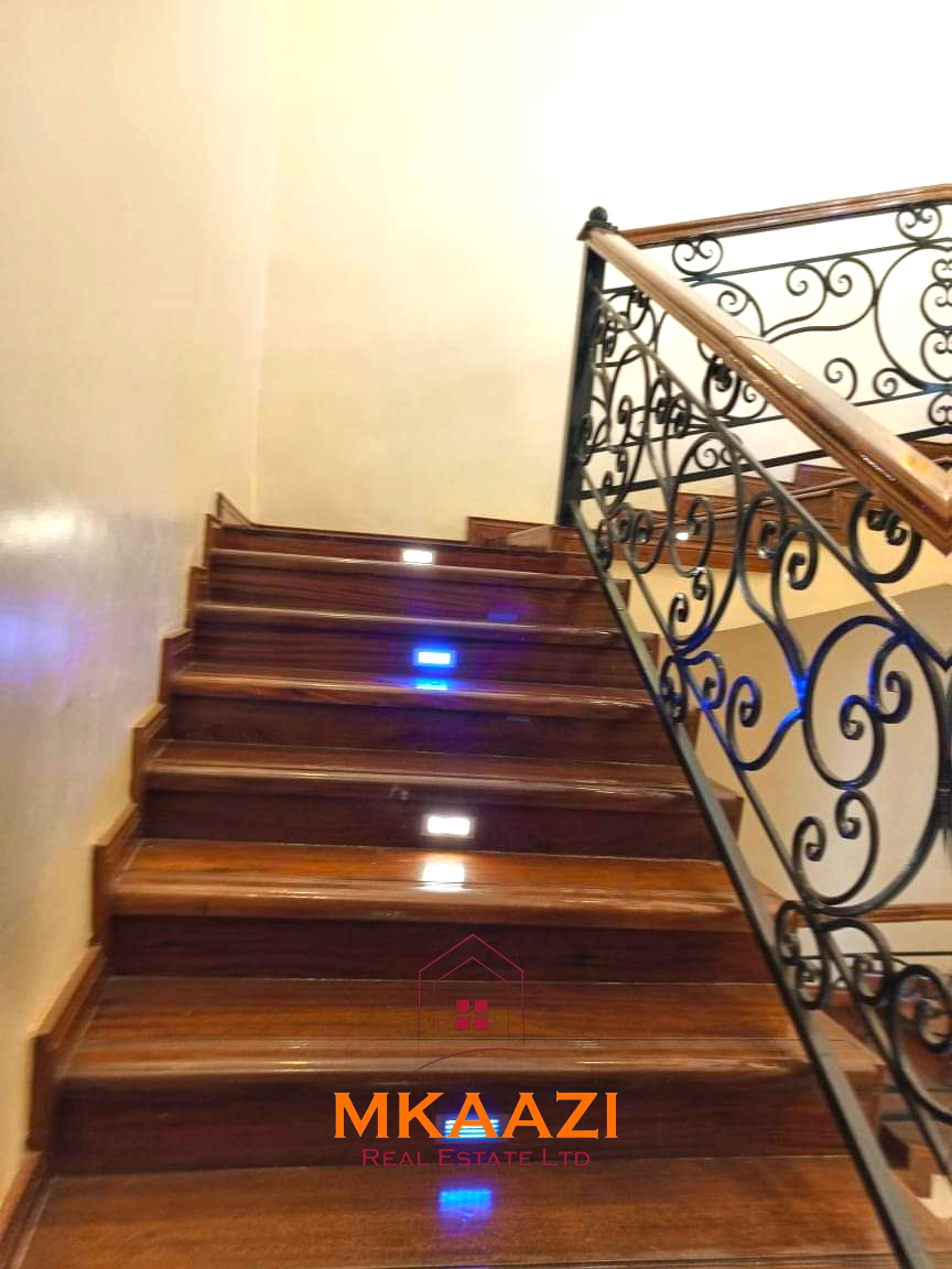 Luxury 6-bedroom all-ensuite mansion for sale in Githingiri Estate, Thika, featuring a gym, safe room, CCTV surveillance, automated gate, electrified perimeter wall, and 35,000-litre underground water tank.