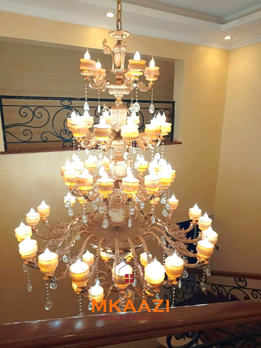 Luxury 6-bedroom all-ensuite mansion for sale in Githingiri Estate, Thika, featuring a gym, safe room, CCTV surveillance, automated gate, electrified perimeter wall, and 35,000-litre underground water tank.