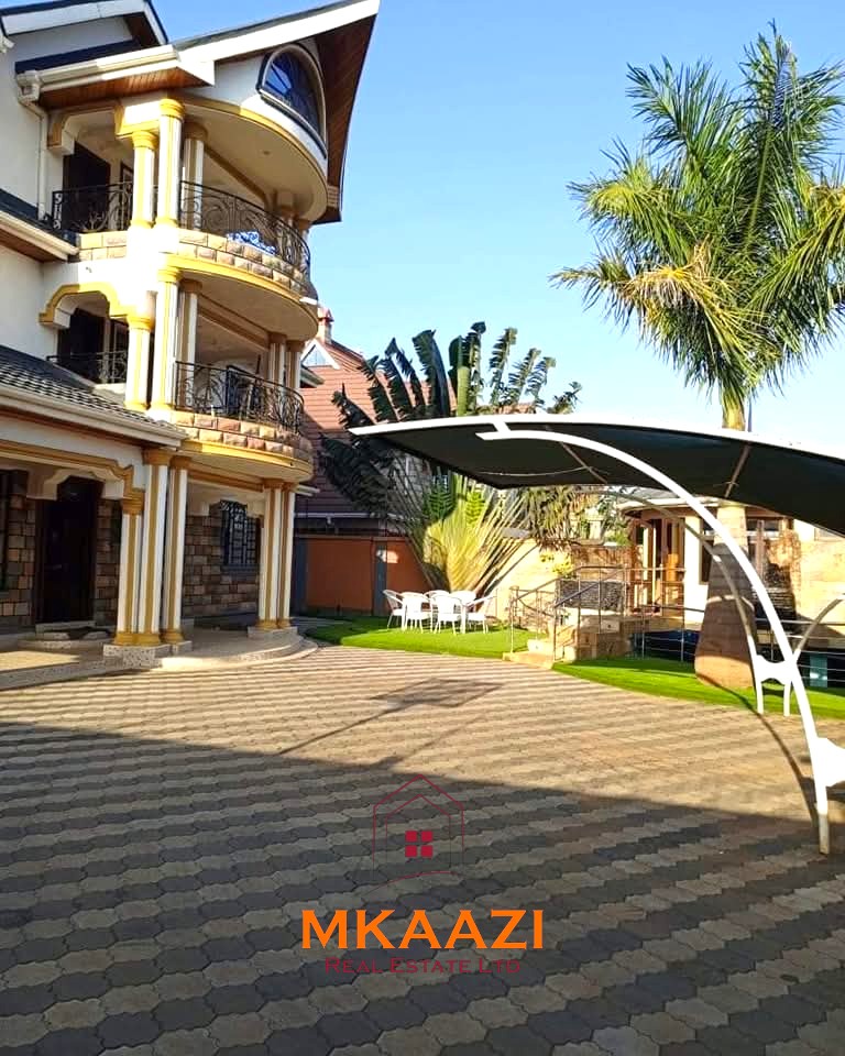 Luxury 6-bedroom all-ensuite mansion for sale in Githingiri Estate, Thika, featuring a gym, safe room, CCTV surveillance, automated gate, electrified perimeter wall, and 35,000-litre underground water tank.
