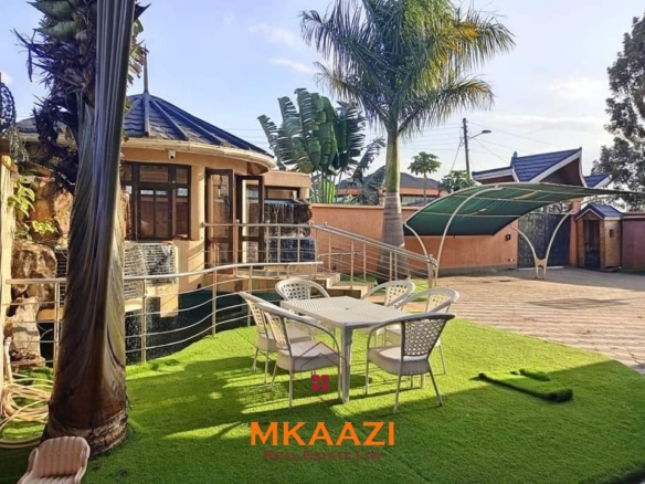 Luxury 6-bedroom all-ensuite mansion for sale in Githingiri Estate, Thika, featuring a gym, safe room, CCTV surveillance, automated gate, electrified perimeter wall, and 35,000-litre underground water tank.