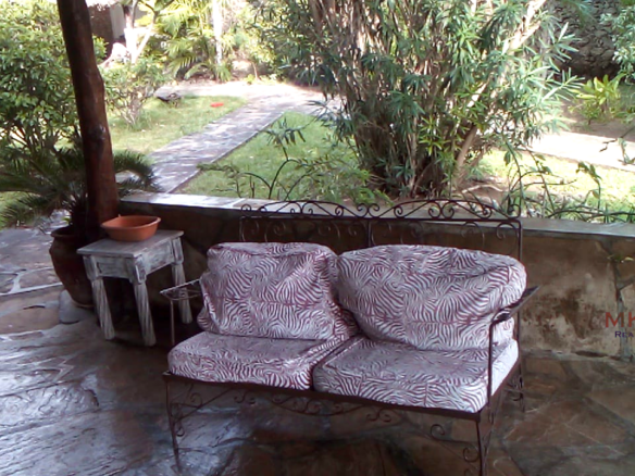 Luxury 3-bedroom villa with staff quarter for sale in Aquarius Watamu on a quarter-acre plot, featuring a gazebo, spacious porch, and walking distance access to the beach.
