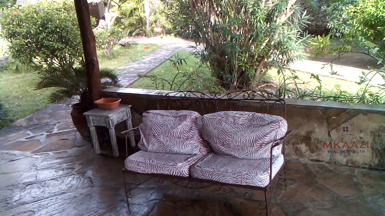 Luxury 3-bedroom villa with staff quarter for sale in Aquarius Watamu on a quarter-acre plot, featuring a gazebo, spacious porch, and walking distance access to the beach.