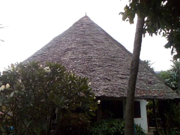 Luxury 3-bedroom villa with staff quarter for sale in Aquarius Watamu on a quarter-acre plot, featuring a gazebo, spacious porch, and walking distance access to the beach.