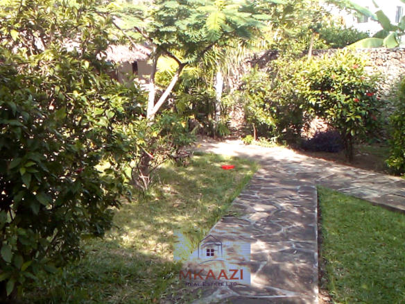 Luxury 3-bedroom villa with staff quarter for sale in Aquarius Watamu on a quarter-acre plot, featuring a gazebo, spacious porch, and walking distance access to the beach.