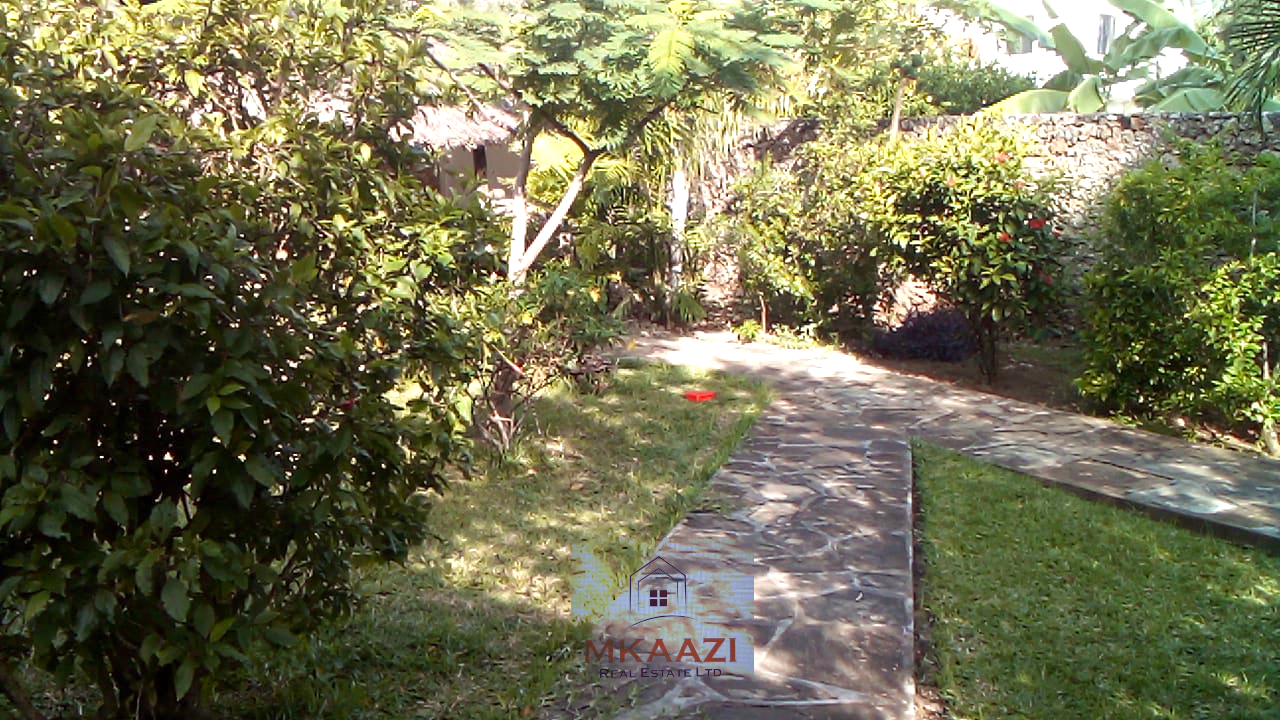 Luxury 3-bedroom villa with staff quarter for sale in Aquarius Watamu on a quarter-acre plot, featuring a gazebo, spacious porch, and walking distance access to the beach.