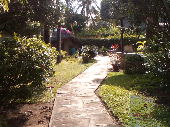 Luxury 3-bedroom villa with staff quarter for sale in Aquarius Watamu on a quarter-acre plot, featuring a gazebo, spacious porch, and walking distance access to the beach.