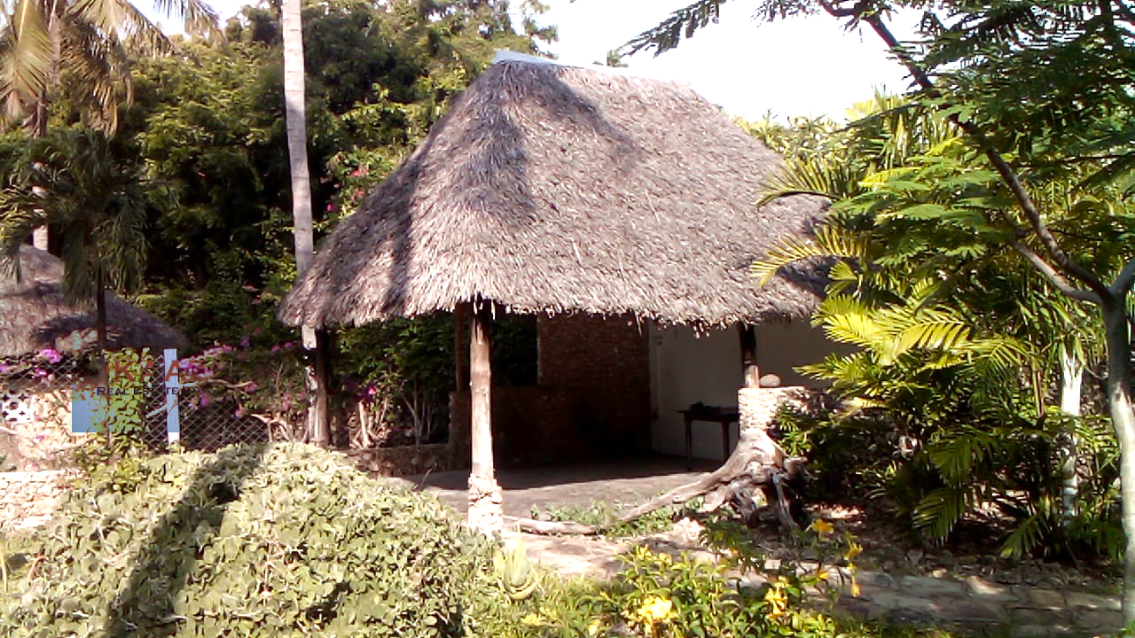 Luxury 3-bedroom villa with staff quarter for sale in Aquarius Watamu on a quarter-acre plot, featuring a gazebo, spacious porch, and walking distance access to the beach.
