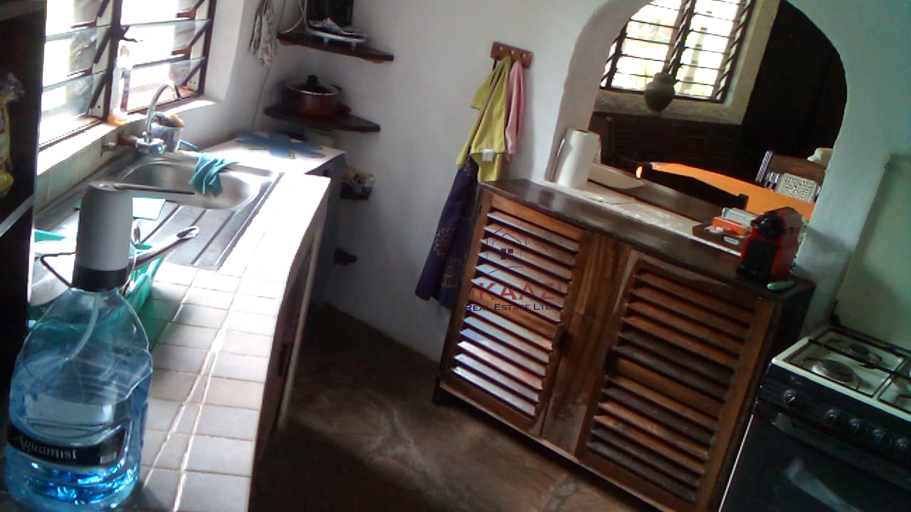 Luxury 3-bedroom villa with staff quarter for sale in Aquarius Watamu on a quarter-acre plot, featuring a gazebo, spacious porch, and walking distance access to the beach.