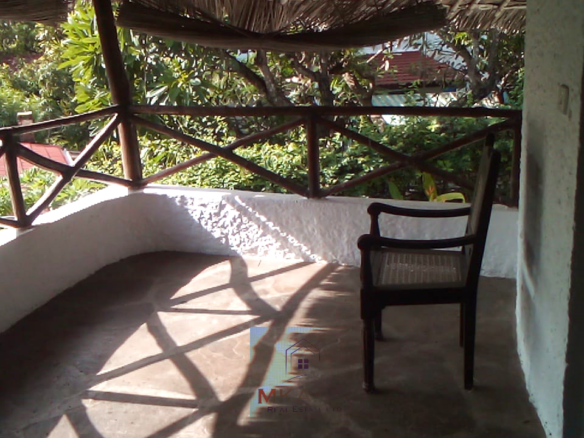 Luxury 3-bedroom villa with staff quarter for sale in Aquarius Watamu on a quarter-acre plot, featuring a gazebo, spacious porch, and walking distance access to the beach.