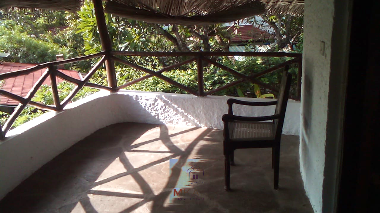 Luxury 3-bedroom villa with staff quarter for sale in Aquarius Watamu on a quarter-acre plot, featuring a gazebo, spacious porch, and walking distance access to the beach.