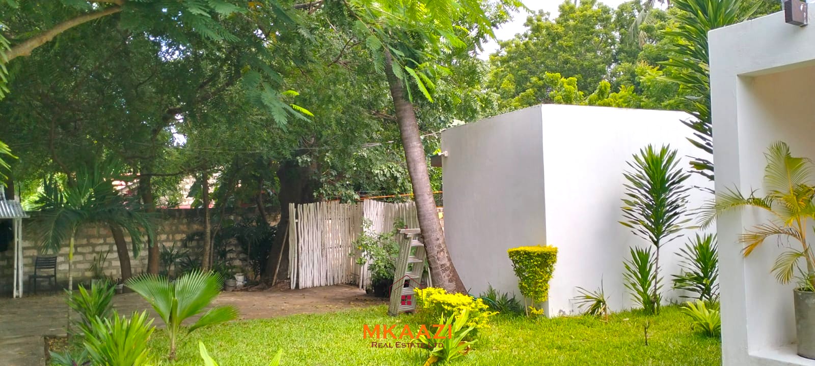 Two 2-bedroom bungalows for sale near Garoda on a quarter-acre property featuring ensuite master bedrooms with bathtubs, swimming pool, landscaped gardens, and operating as a hospitality business.