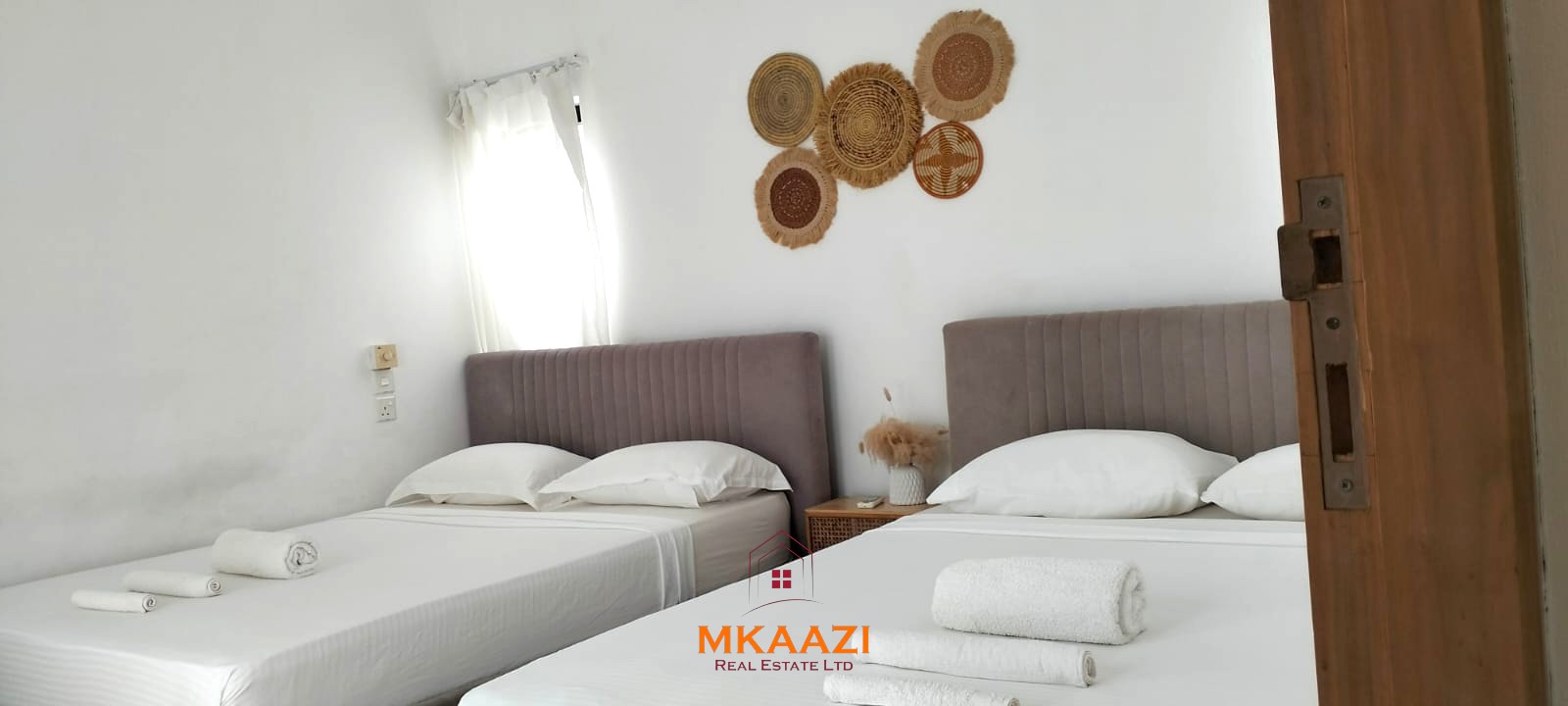 Two 2-bedroom bungalows for sale near Garoda on a quarter-acre property featuring ensuite master bedrooms with bathtubs, swimming pool, landscaped gardens, and operating as a hospitality business.