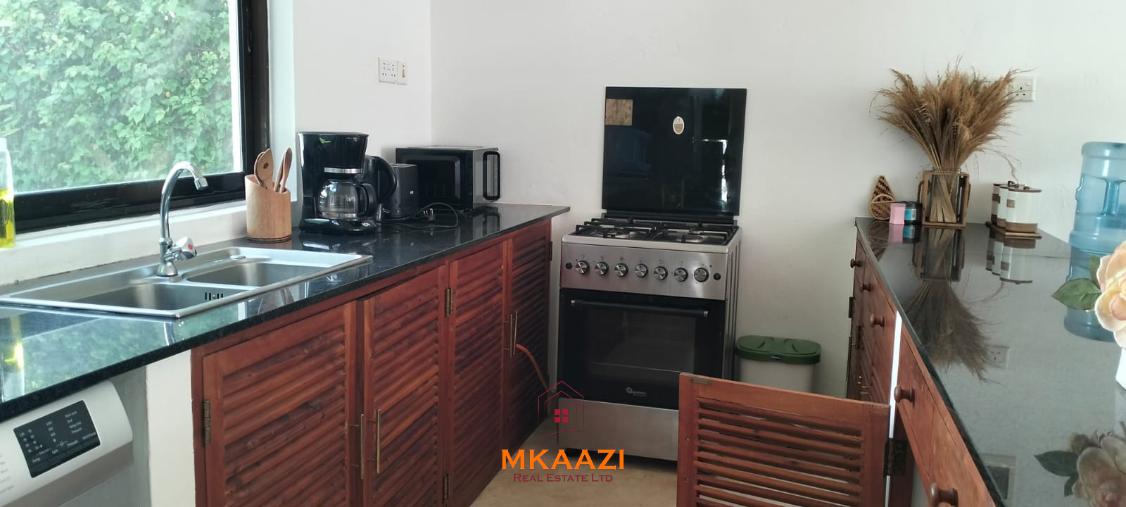 Two 2-bedroom bungalows for sale near Garoda on a quarter-acre property featuring ensuite master bedrooms with bathtubs, swimming pool, landscaped gardens, and operating as a hospitality business.