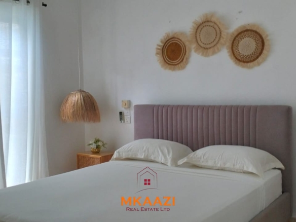Two 2-bedroom bungalows for sale near Garoda on a quarter-acre property featuring ensuite master bedrooms with bathtubs, swimming pool, landscaped gardens, and operating as a hospitality business.
