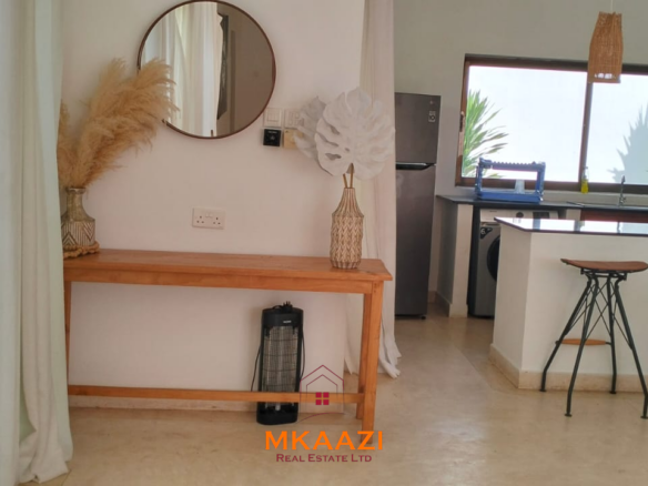Two 2-bedroom bungalows for sale near Garoda on a quarter-acre property featuring ensuite master bedrooms with bathtubs, swimming pool, landscaped gardens, and operating as a hospitality business.