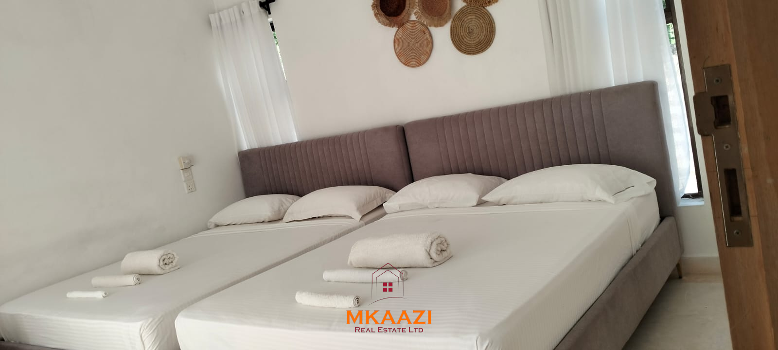 Two 2-bedroom bungalows for sale near Garoda on a quarter-acre property featuring ensuite master bedrooms with bathtubs, swimming pool, landscaped gardens, and operating as a hospitality business.