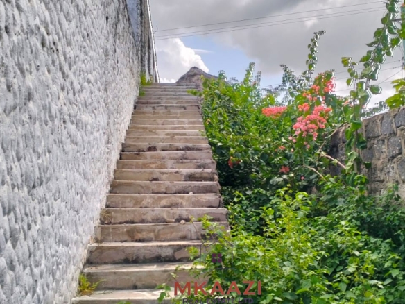 16 one-bedroom units and a 3-bedroom main house for sale near Blue Bay Watamu on 0.4 acres, 300 meters from the beach with a partially completed swimming pool.