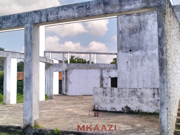 16 one-bedroom units and a 3-bedroom main house for sale near Blue Bay Watamu on 0.4 acres, 300 meters from the beach with a partially completed swimming pool.