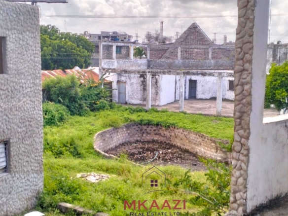 16 one-bedroom units and a 3-bedroom main house for sale near Blue Bay Watamu on 0.4 acres, 300 meters from the beach with a partially completed swimming pool.
