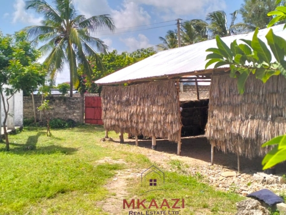 16 one-bedroom units and a 3-bedroom main house for sale near Blue Bay Watamu on 0.4 acres, 300 meters from the beach with a partially completed swimming pool.