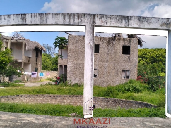 16 one-bedroom units and a 3-bedroom main house for sale near Blue Bay Watamu on 0.4 acres, 300 meters from the beach with a partially completed swimming pool.