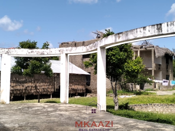 16 one-bedroom units and a 3-bedroom main house for sale near Blue Bay Watamu on 0.4 acres, 300 meters from the beach with a partially completed swimming pool.
