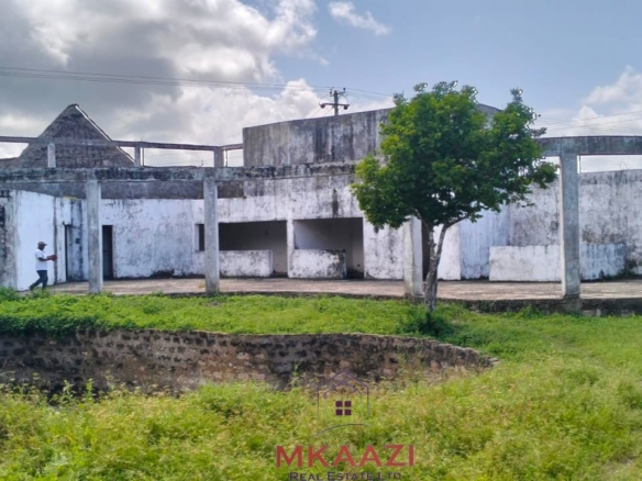16 one-bedroom units and a 3-bedroom main house for sale near Blue Bay Watamu on 0.4 acres, 300 meters from the beach with a partially completed swimming pool.