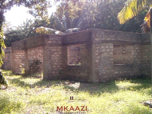 ½ acre freehold property for sale in Garoda Watamu with five semi-finished one and two-bedroom units, ideal for rental income and hospitality investment.