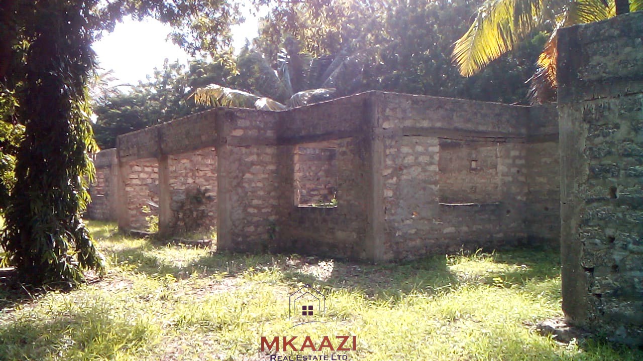 ½ acre freehold property for sale in Garoda Watamu with five semi-finished one and two-bedroom units, ideal for rental income and hospitality investment.