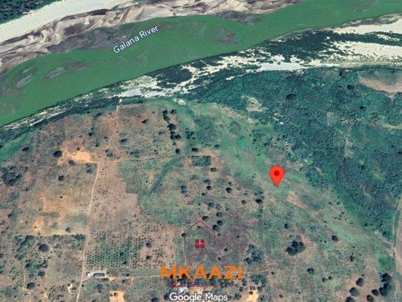 7-acre freehold agricultural land for sale or lease in Nyamala near River Sabaki with red soil, irrigation access, Napier grass cultivation, and elevated flood-safe terrain.