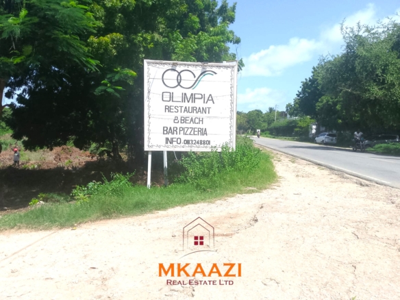 Half-acre road frontage plot for sale on Casuarina Road, Malindi, near the beach and Marine Park, suitable for apartments, restaurants, resorts, and hospitality developments.