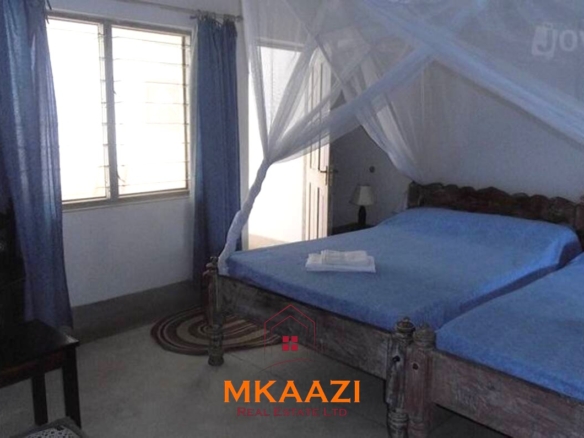 Fully furnished 85 sqm one-bedroom apartment for sale at Blue Marlin Sporting Resort Malindi with pool, gym, security, reception, and beach access.
