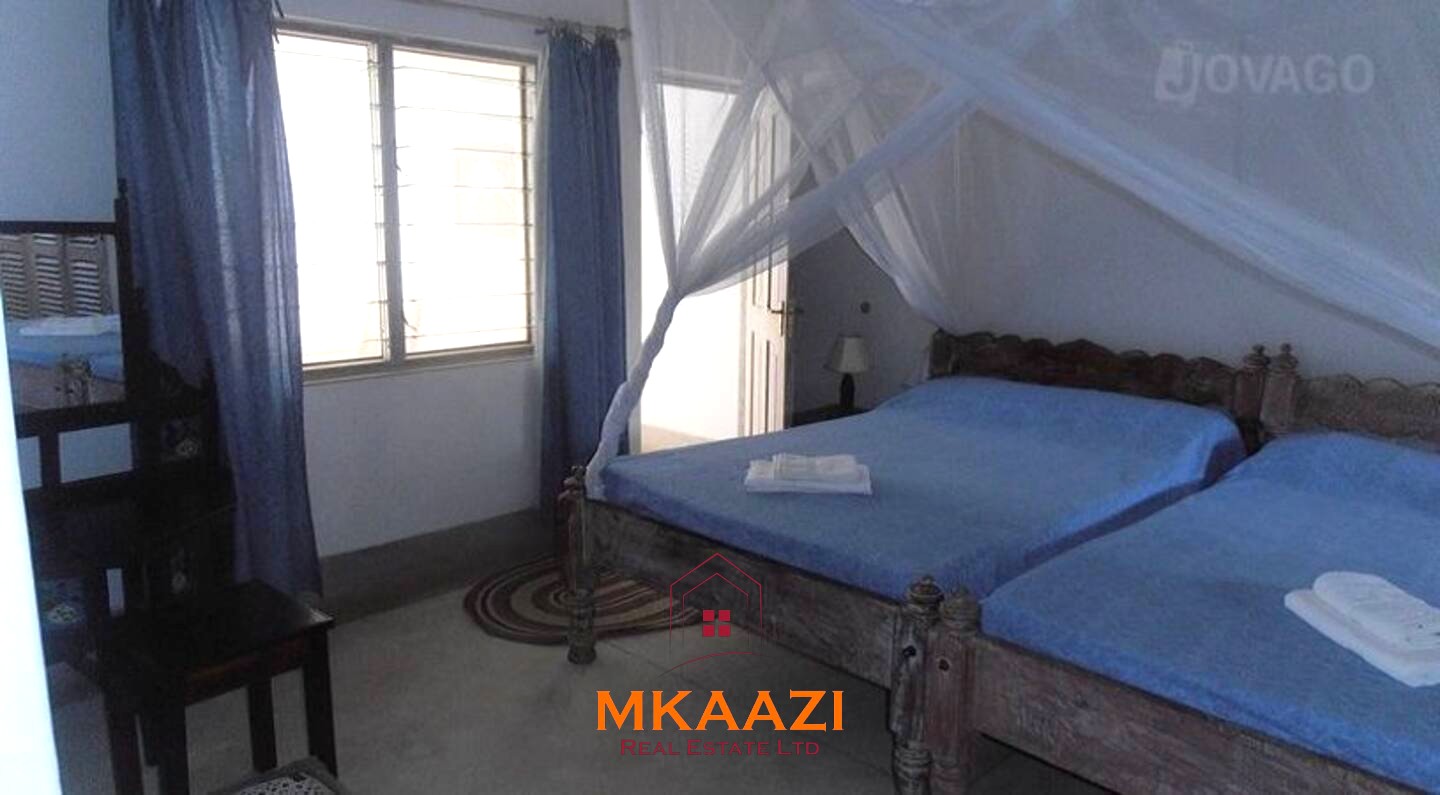Fully furnished 85 sqm one-bedroom apartment for sale at Blue Marlin Sporting Resort Malindi with pool, gym, security, reception, and beach access.