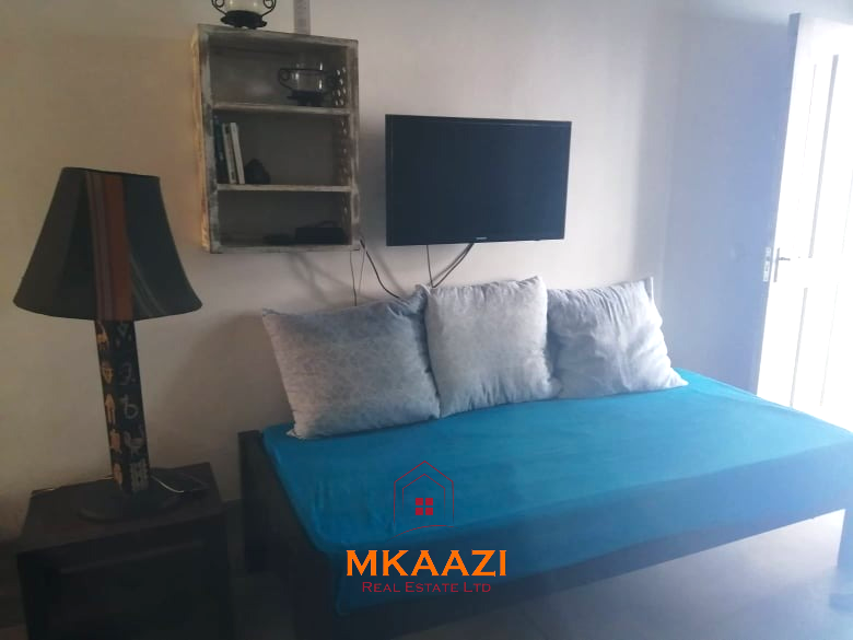 Fully furnished 85 sqm one-bedroom apartment for sale at Blue Marlin Sporting Resort Malindi with pool, gym, security, reception, and beach access.